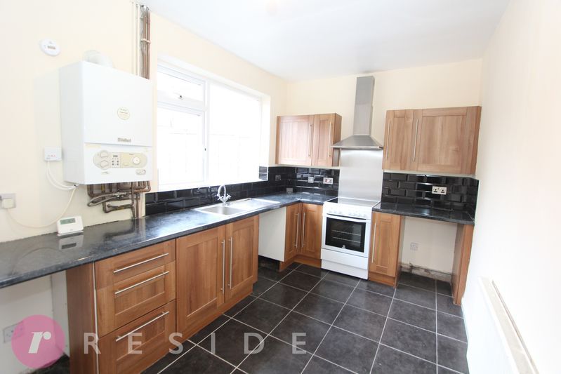 Property photo 3 of 12 Dining Kitchen