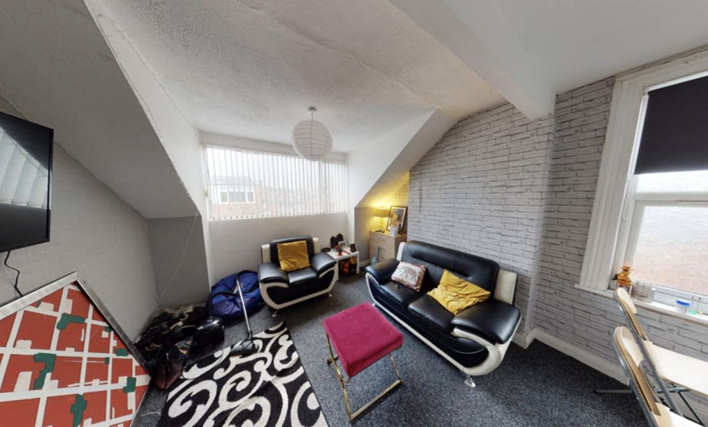 Property photo 3 of 6 Bright And Modern Living Room Featuring A Comforta...