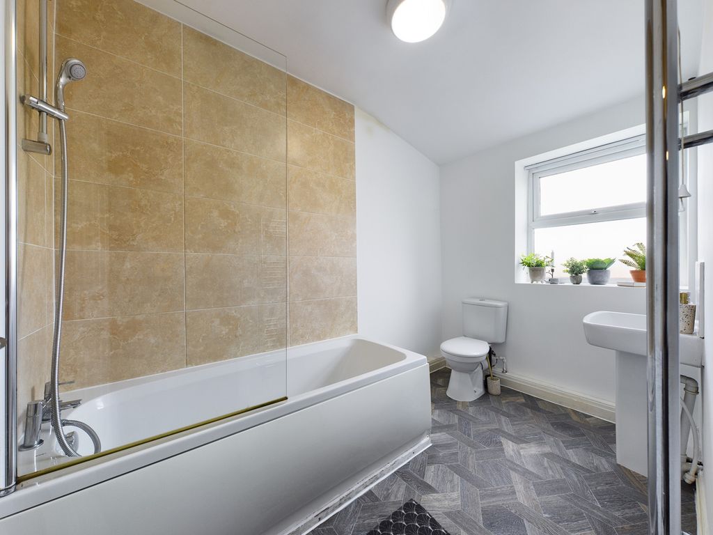 Property photo 1 of 13 A Spacious And Bright Bathroom Featuring A Modern ...