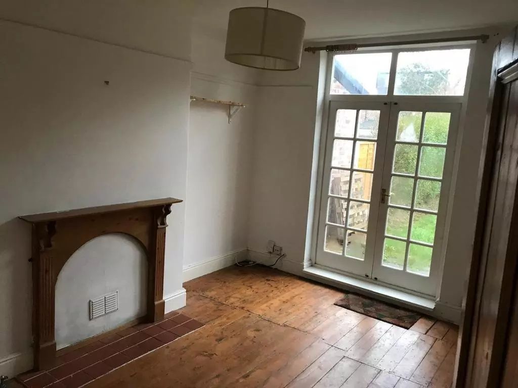 Property photo 3 of 8 A Charming Living Room Featuring Classic Wooden Fl...