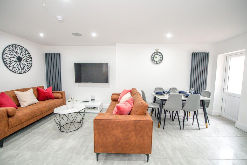 Property photo 1 of 14 A Modern, Bright Living Room Featuring Comfortable...