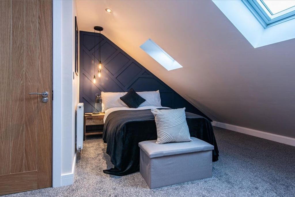 Property photo 3 of 9 This Stylish Double Bedroom Features A Cozy Ambian...
