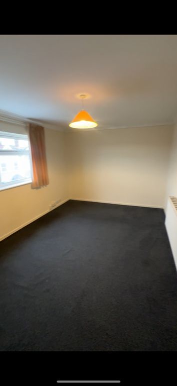 Property photo 3 of 5 Bright And Welcoming Living Room With Natural Ligh...