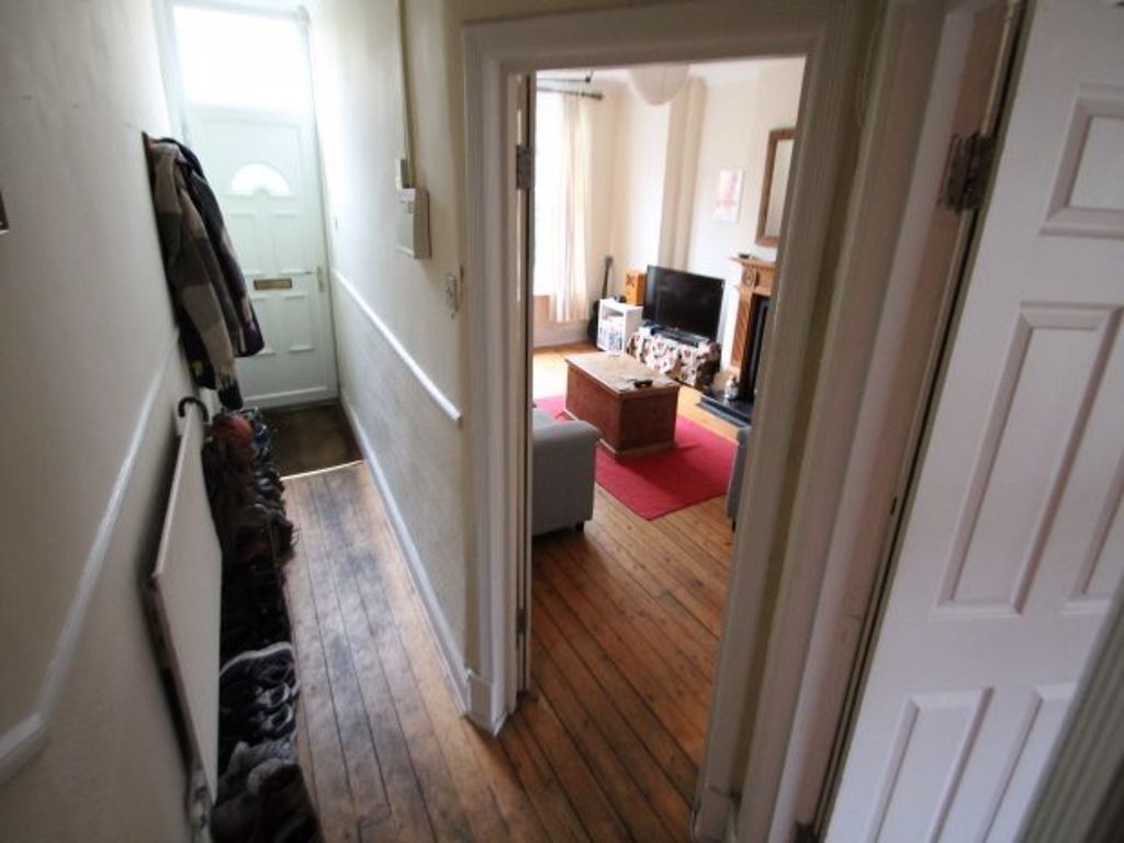 Property photo 3 of 17 A Well-Lit, Comfortable Living Room Featuring Mode...