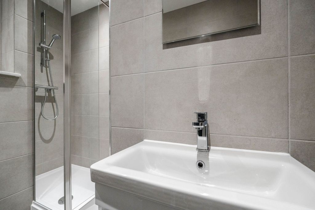 Property photo 3 of 3 Modern Bathroom Featuring A Sleek Sink, Chrome Fix...