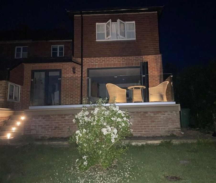 Property photo 3 of 17 Rear Elevation Night