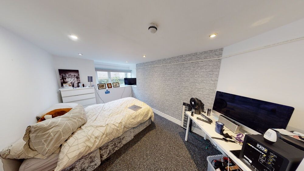 Property photo 1 of 19 A Spacious And Well-Lit Master Bedroom Featuring A...