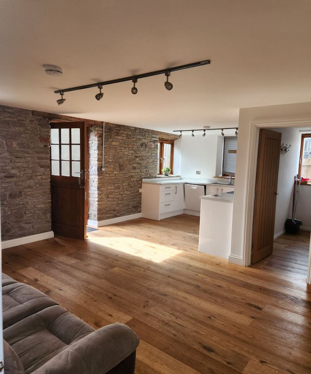 Property photo 3 of 17 A Charming Living Room With Rustic Exposed Stone W...