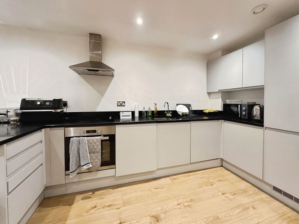 Property photo 2 of 8 Kitchen Area