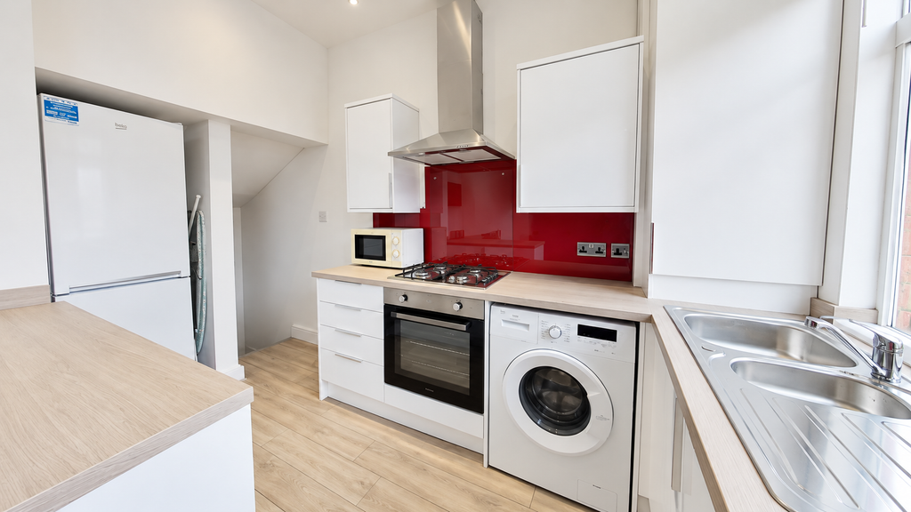 Property photo 1 of 10 Bright Modern Kitchen With Red Splashback