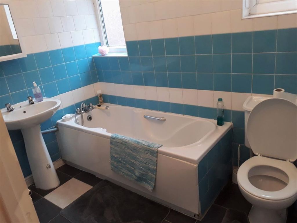 Property photo 1 of 12 Bright, Tiled Bathroom Featuring A Full-Size Batht...