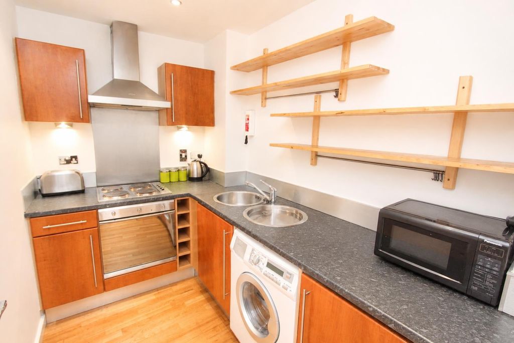 Property photo 2 of 9 Bright Kitchen With Ample Storage And Appliances...