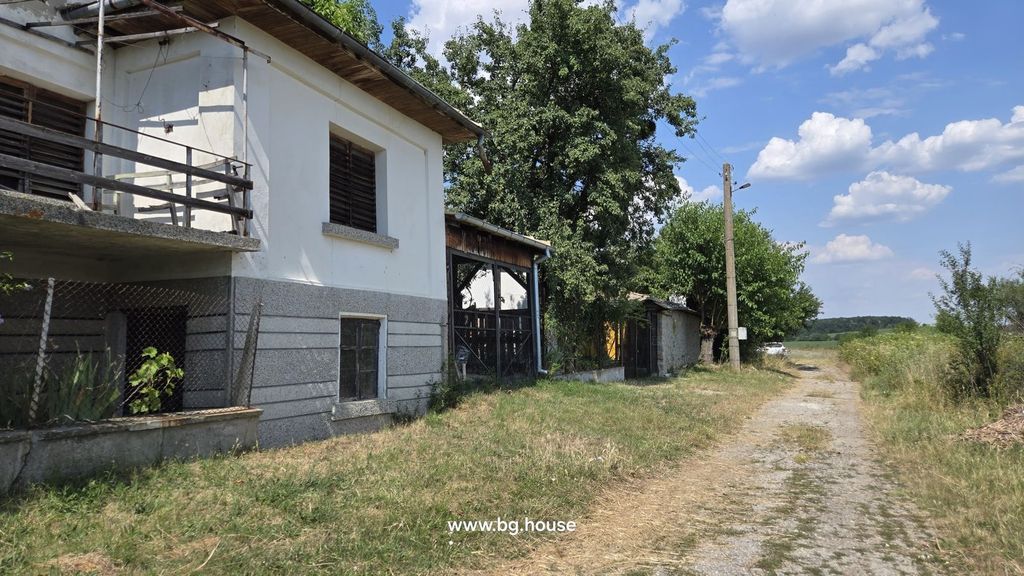 Property photo 2 of 99 Side View Of A White Two-Storey House With Wooden Shutters And Fenced Garden Next To A Rural Dirt Road