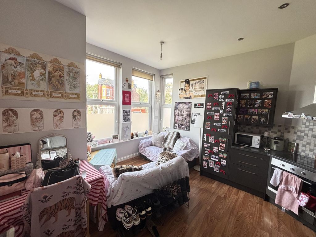 Property photo 1 of 7 Bright And Inviting Living Room With Ample Natural...