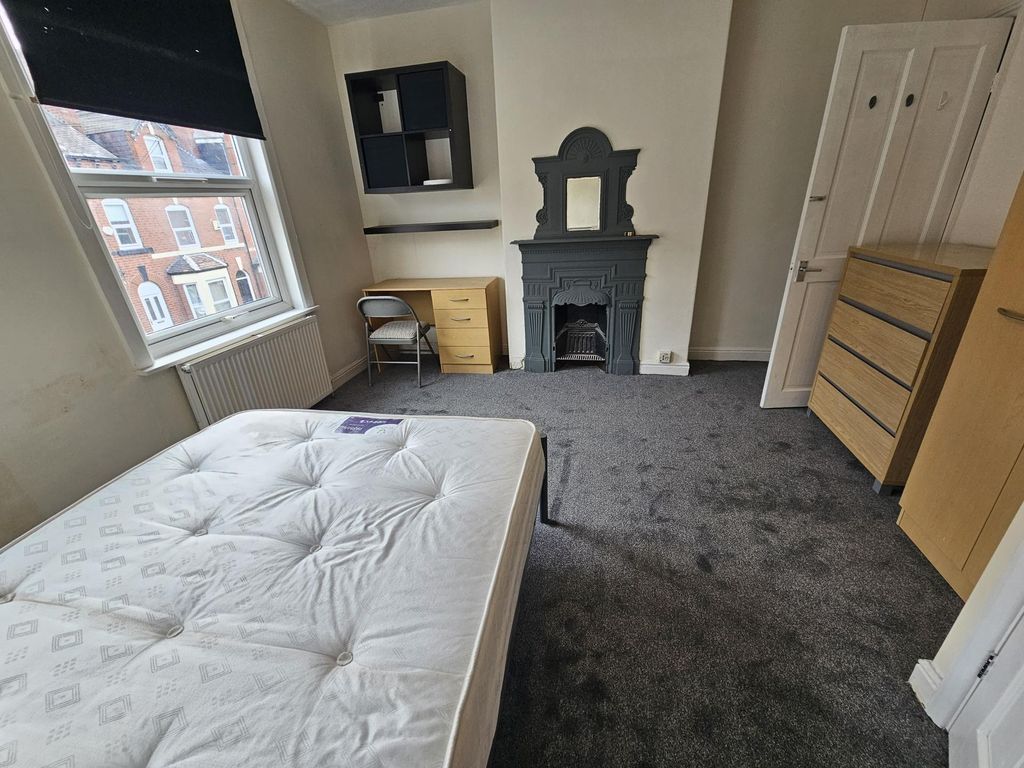 Property photo 3 of 12 A Bright And Welcoming Living Room Featuring A Lar...