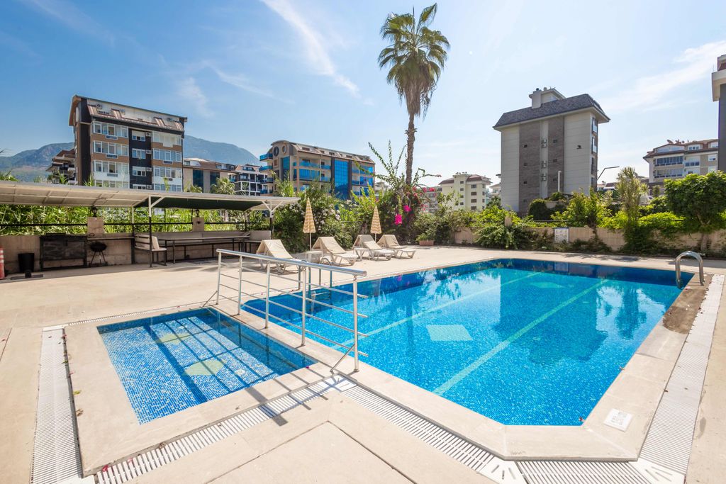 Property photo 3 of 20 Seafront Apartment For Sale In Alanya - Enticing Communal Swimming Pool