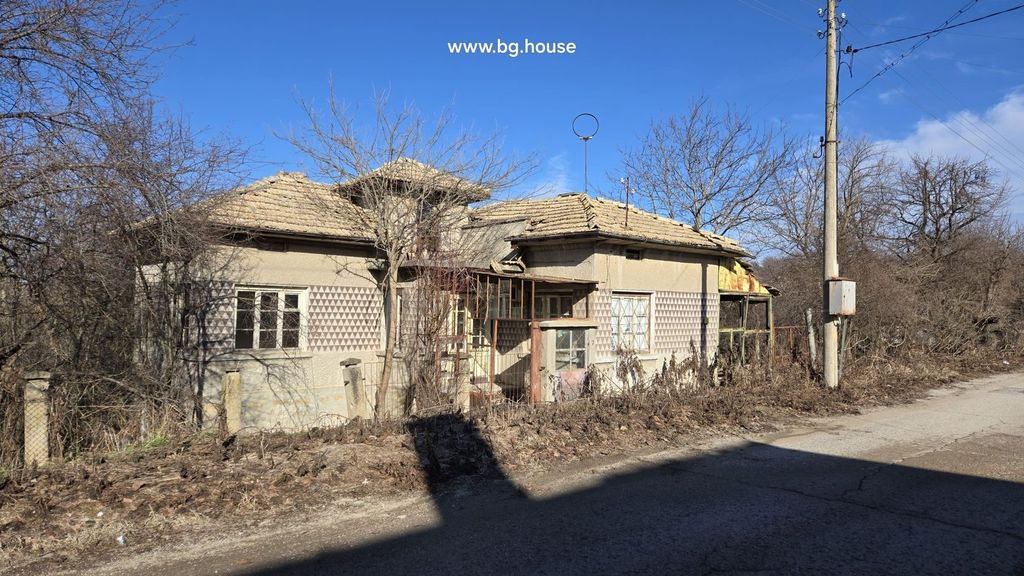 Property photo 1 of 29 Front View Of An Old Village House With Decorative Triangular Pattern On Walls And A Tiled Roof.