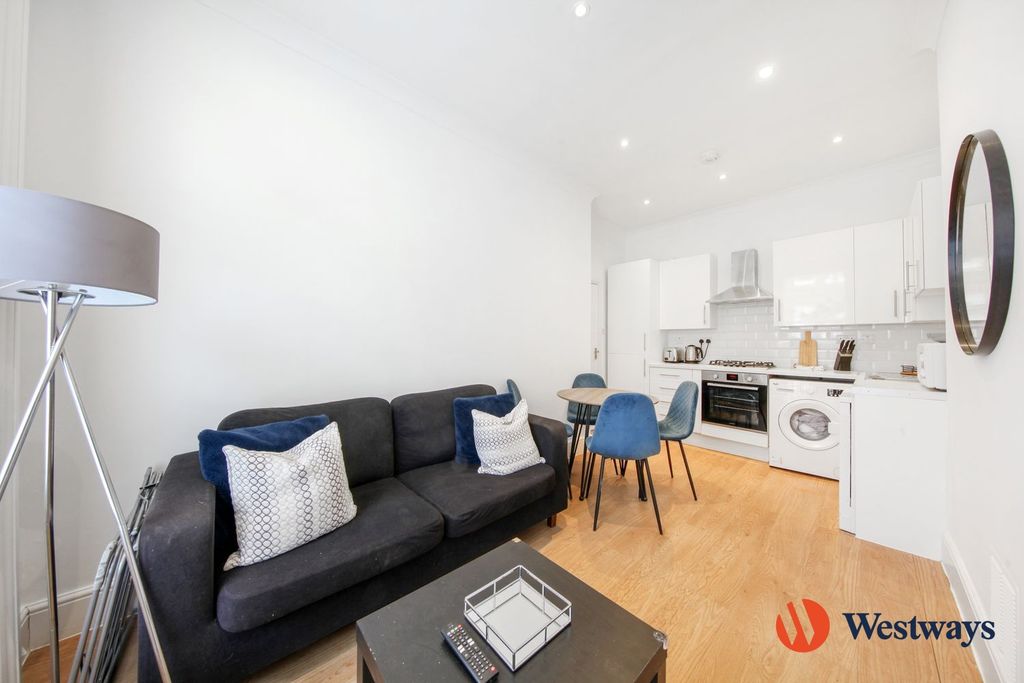 Property photo 1 of 8 Living Area + Kitchen