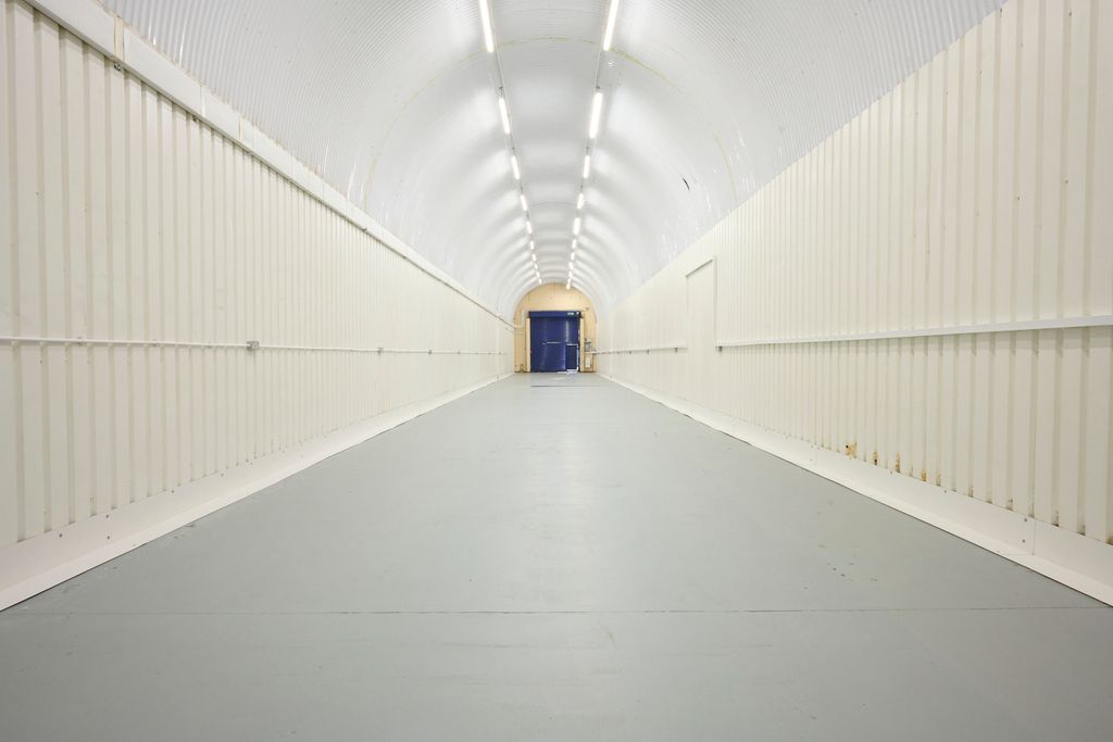 Property photo 3 of 4 An Empty Arch With White Lining, Facing The Front Electric Roller Shutter Entrance, Which Is Closed.