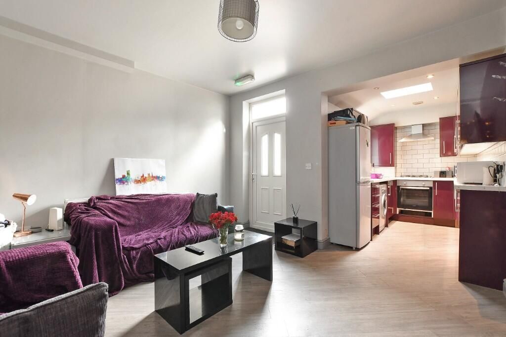 Property photo 3 of 9 A Cozy And Well-Maintained Living Room Featuring A...