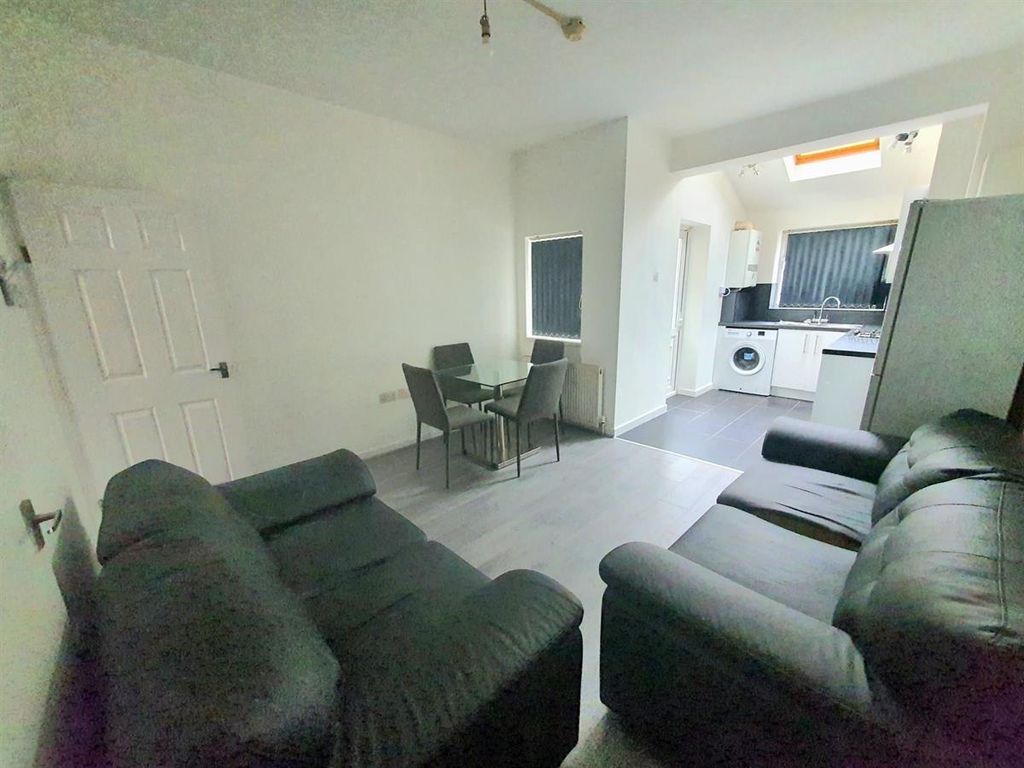 Property photo 2 of 15 Spacious Open-Plan Lounge With Plush Sofas And Din...