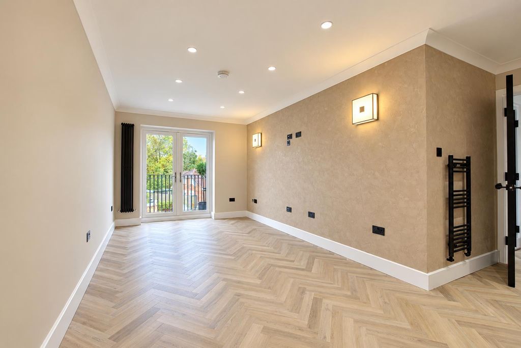 Property photo 2 of 9 Minimalist Beige Room With French Doors.Png