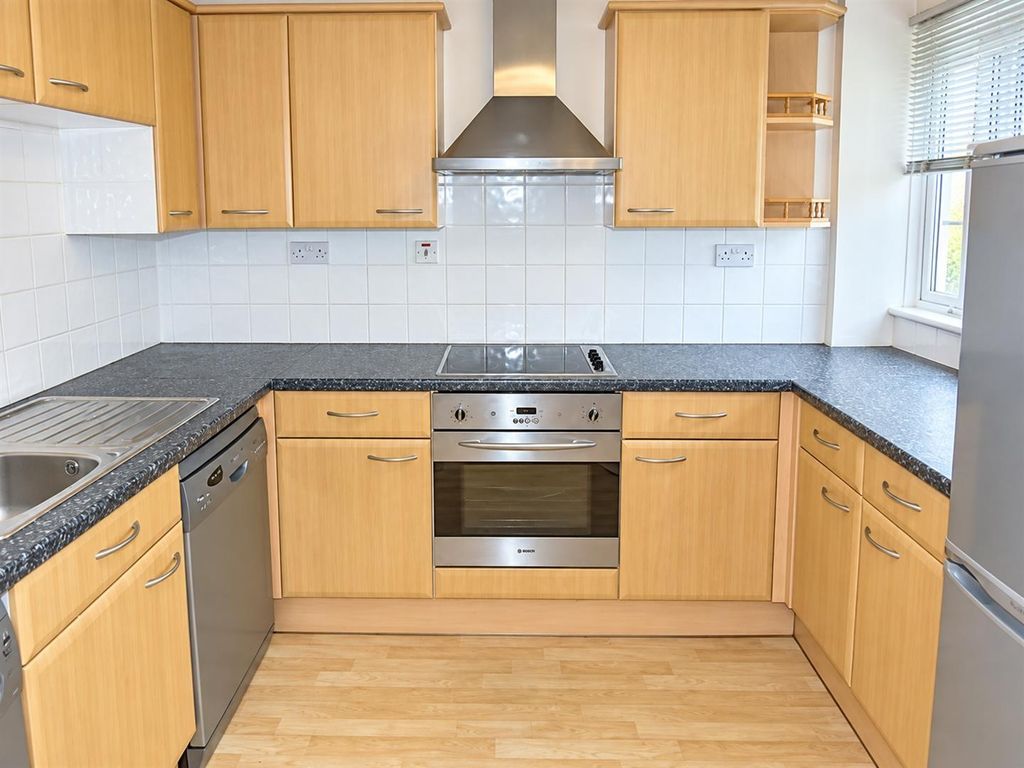 Property photo 2 of 8 Bright Kitchen With Ample Storage And Dishwasher...