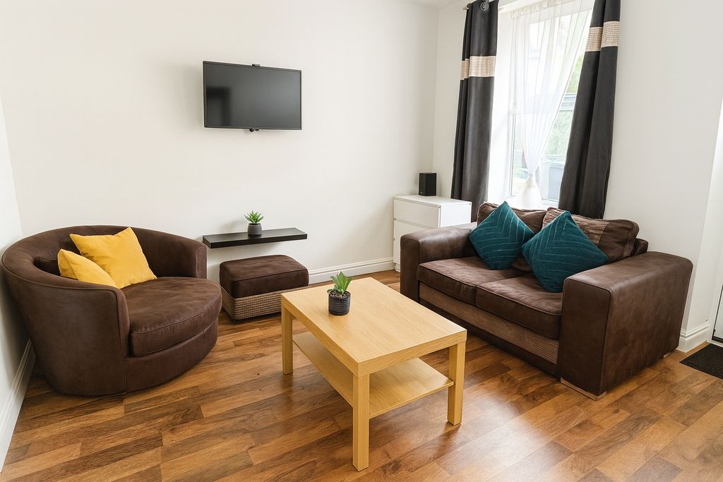 Property photo 2 of 6 A Bright, Comfortable Living Room Featuring A Larg...