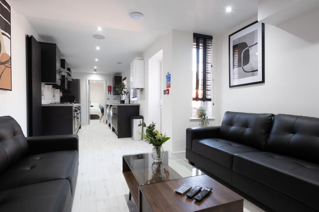 Property photo 3 of 14 A Modern And Stylish Living Room Featuring Sleek B...