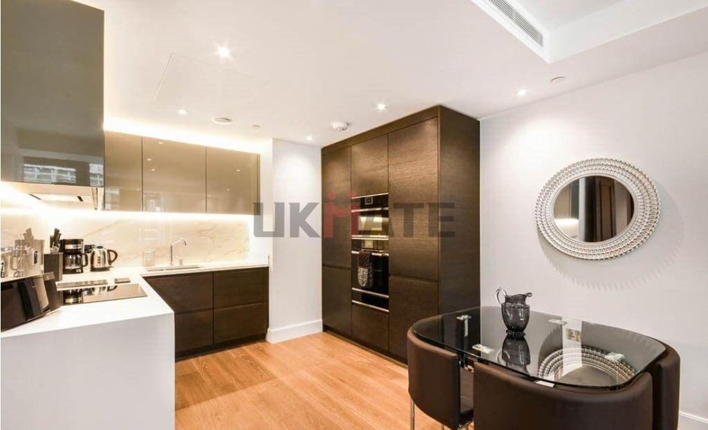 Property photo 3 of 9 Modern And Sleek Kitchen With Polished Cabinetry, ...