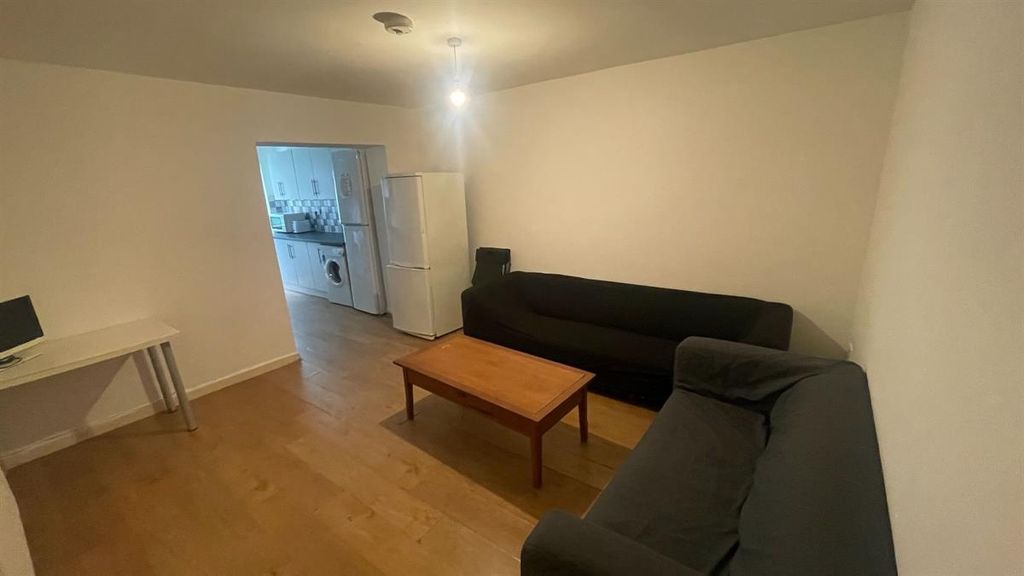 Property photo 1 of 13 A Spacious And Inviting Living Room With A Modern ...