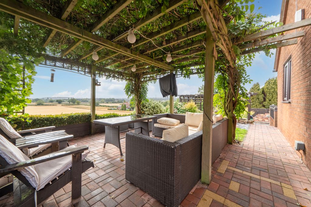 Property photo 2 of 30 Covered Seating Area