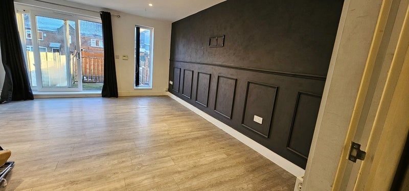 Property photo 1 of 8 A Spacious And Modern Living Room Featuring Light ...