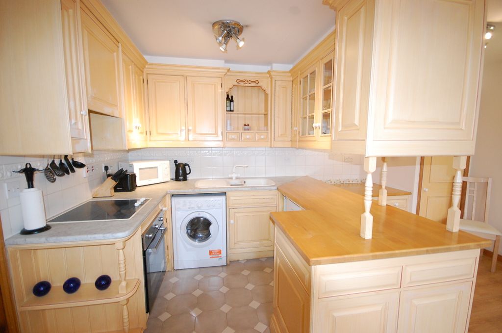 Property photo 3 of 8 Kitchen