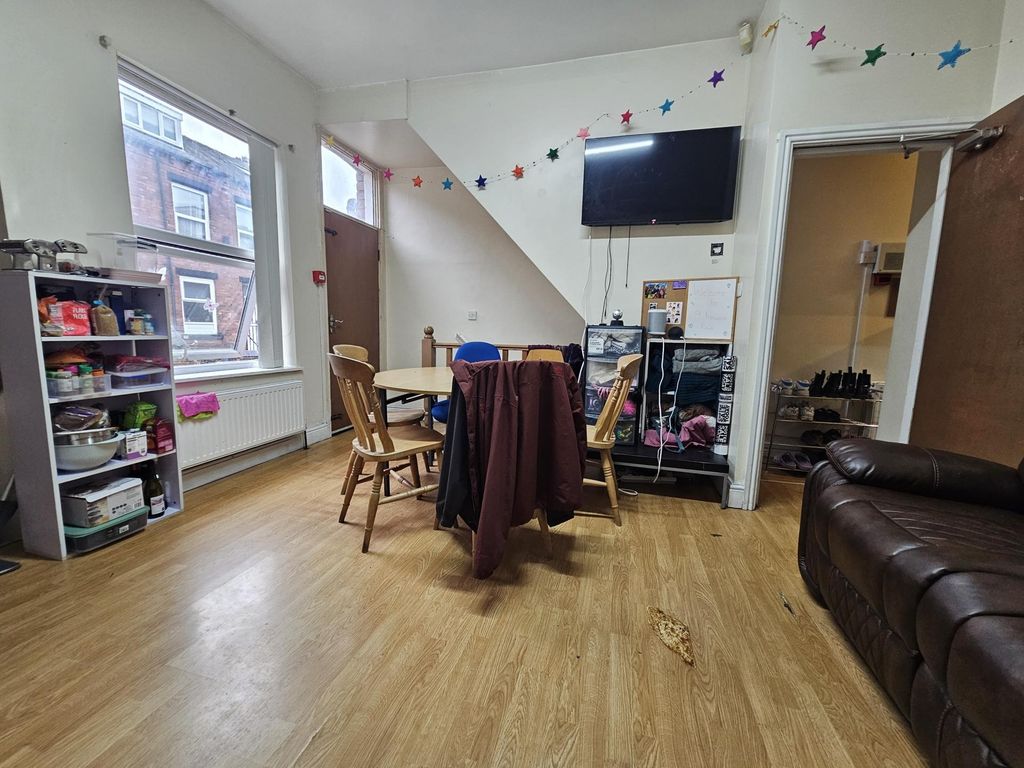 Property photo 1 of 25 A Bright And Welcoming Living Room Featuring A Com...