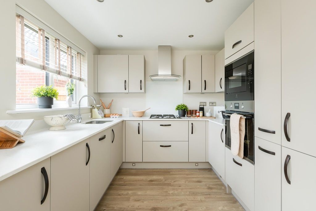 Property photo 2 of 13 Modern Kitchen With Ample Storage And Worktop Space