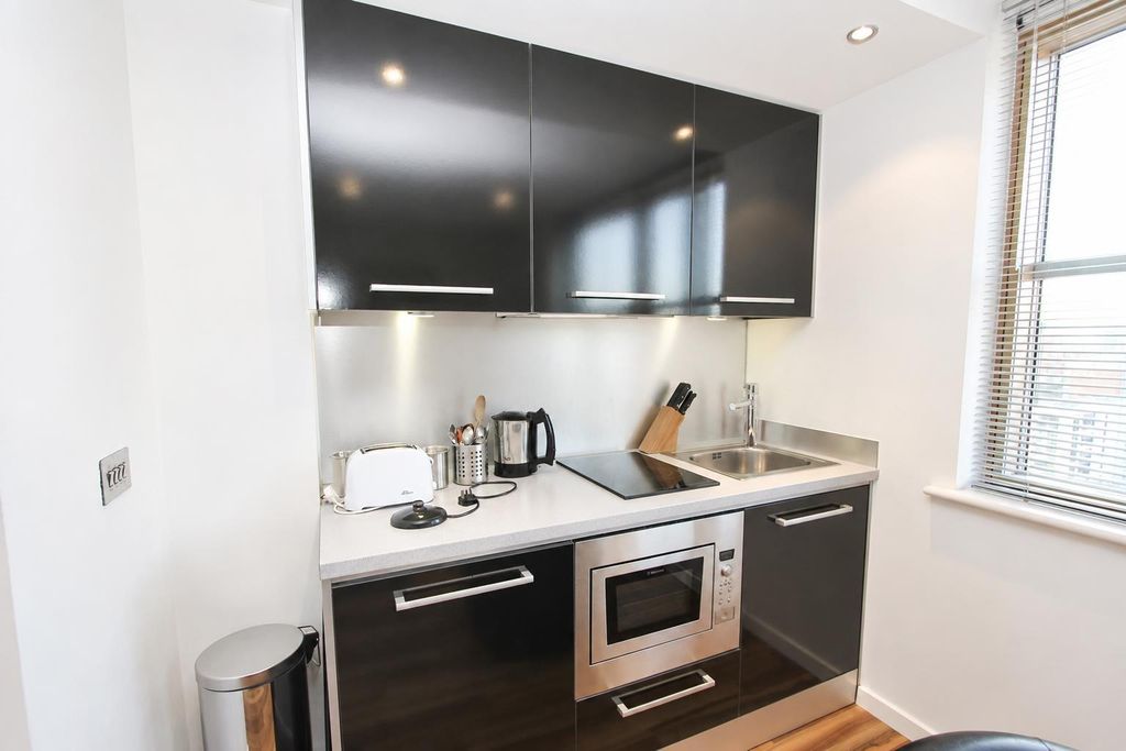 Property photo 2 of 6 Modern Gloss Kitchen With Sleek Integrated Applian...