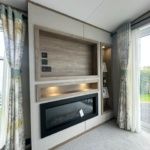 Property photo 2 of 7 Modern Feature Fireplace And Built In Shelving In The Abi Ingleton Lounge
