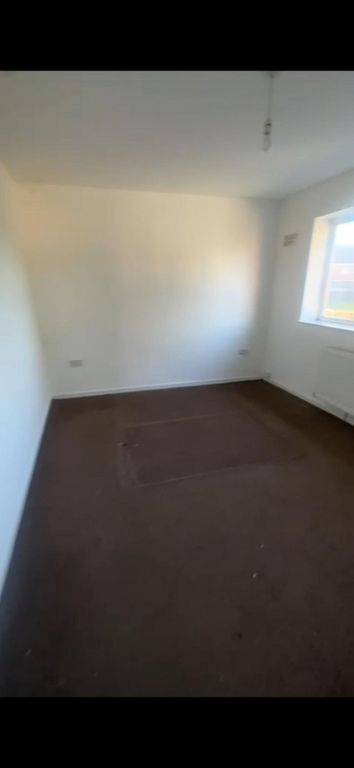 Property photo 3 of 14 A Modest Bedroom With Plain White Walls, A Single ...