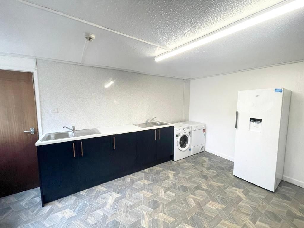 Property photo 3 of 9 Spacious Utility Area With Modern Appliances...