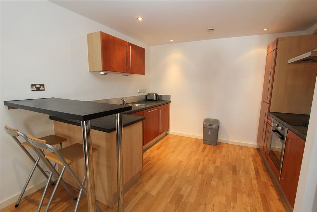 Property photo 3 of 9 Modern Kitchen With Breakfast Bar And Sleek Units...