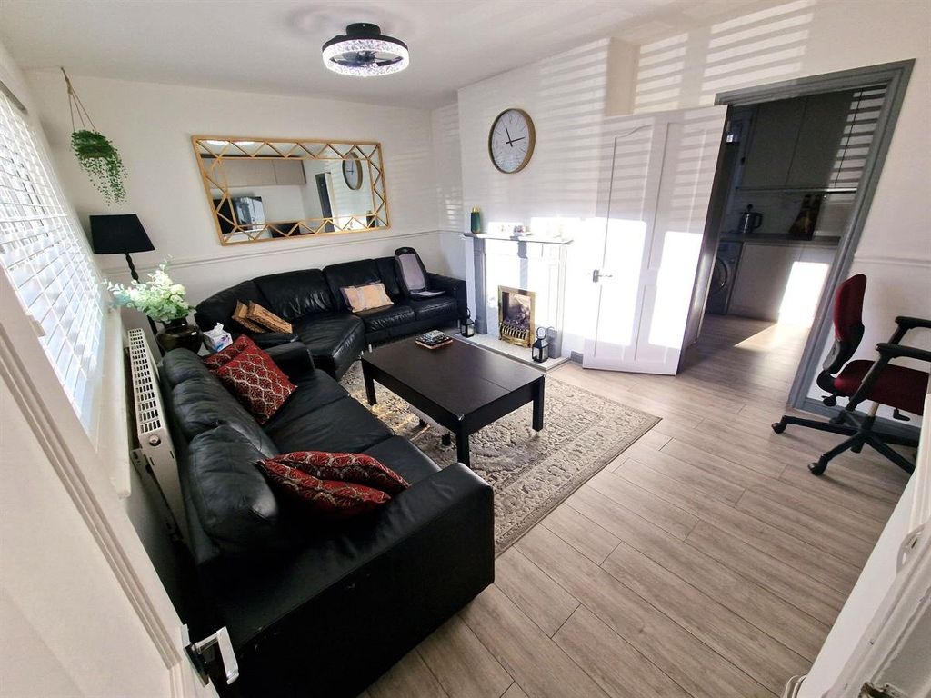 Property photo 2 of 10 A Bright And Modern Living Room Featuring A Large ...