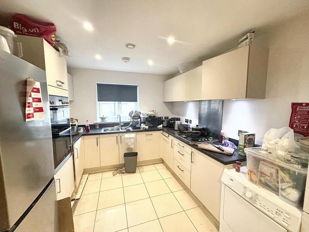 Property photo 3 of 7 Modern, Well-Lit Kitchen Area With Ample Counter S...