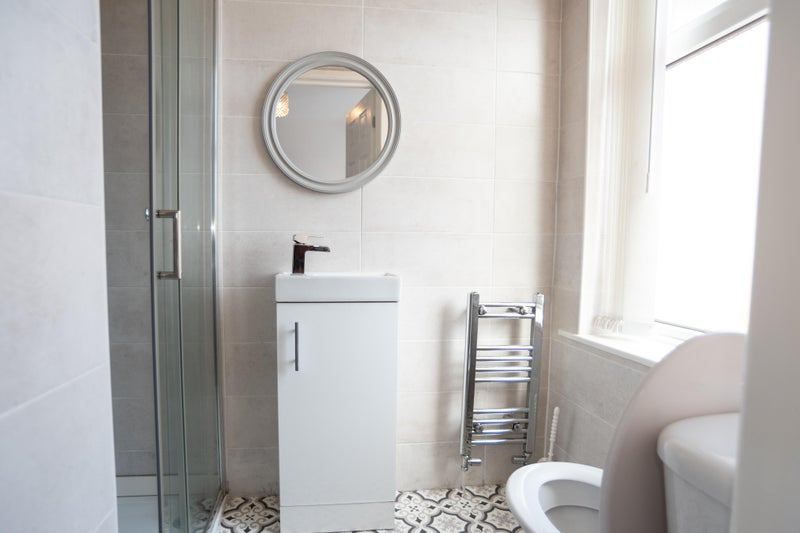 Property photo 2 of 12 Bright, Modern Bathroom With A Glass Shower Enclos...