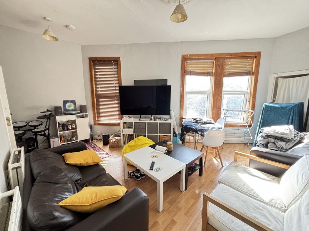 Property photo 3 of 21 A Bright And Welcoming Living Room Featuring Large...