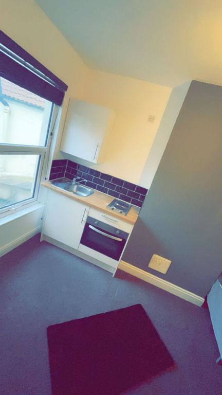Property photo 1 of 4 A Compact, Well-Lit Kitchen Area Featuring A Windo...