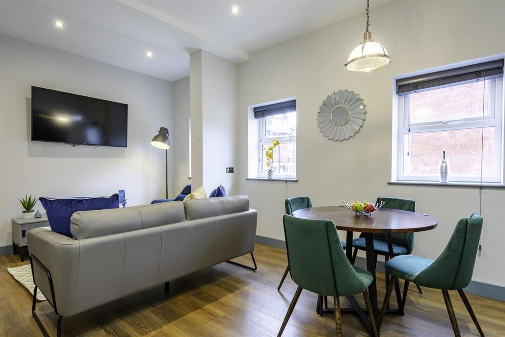 Property photo 3 of 8 Bright Open-Plan Living And Dining Area With TV...