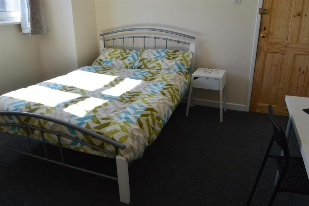 Property photo 3 of 10 Comfortable Double Bedroom Featuring Ample Natural...