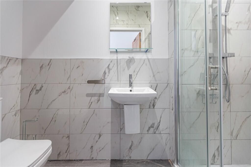 Property photo 2 of 15 Bright And Modern Bathroom Suite Featuring Elegant...