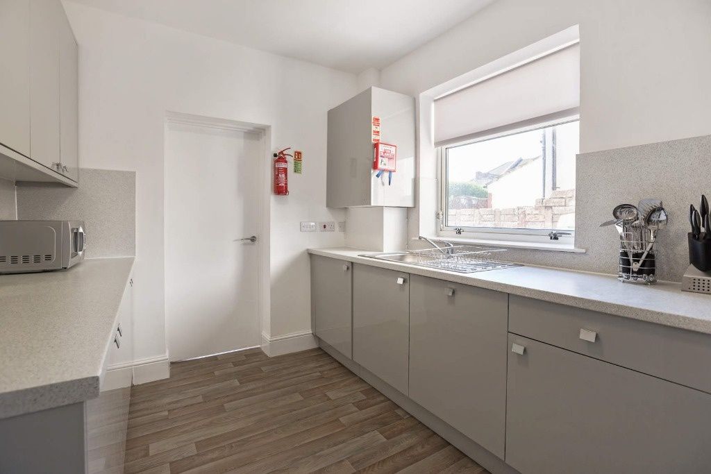 Property photo 3 of 8 Bright, Modern Galley Kitchen With Pale Grey Cabin...